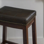 Tabouret de comptoir sans dossier en similicuir Claridge