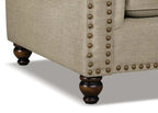 Fauteuil en tissu chenille avec garniture cloutée et pieds tournés en bois