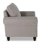 Fauteuil en tissu chenille avec garniture cloutée et pieds tournés en bois